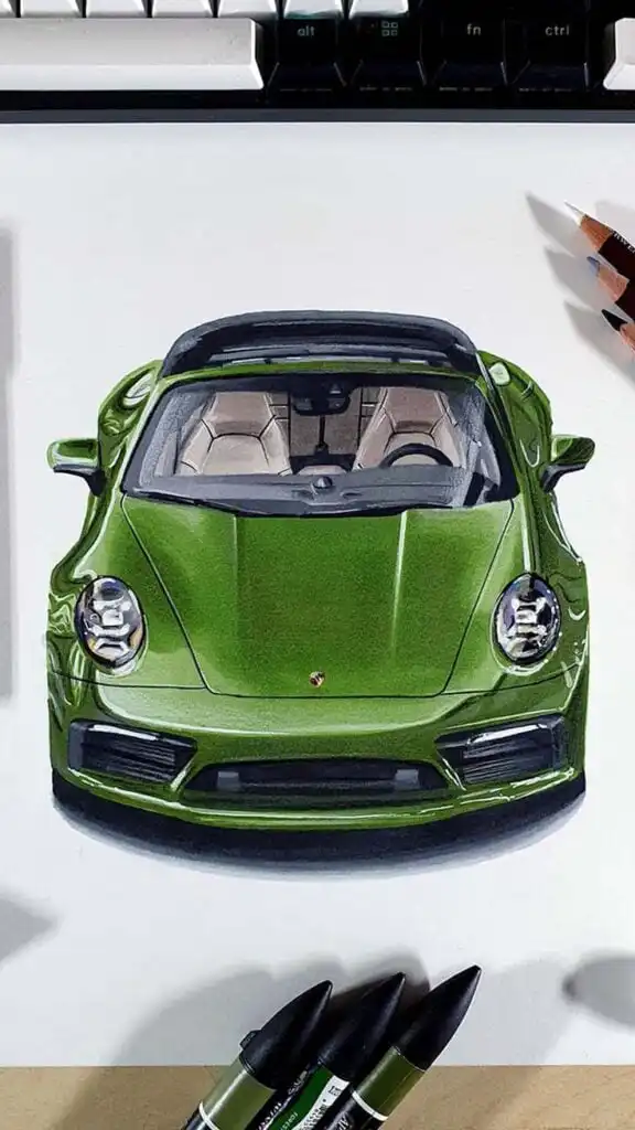 Illustration of a sleek green sports car viewed from the front, surrounded by pencils and markers on a designer's desk.