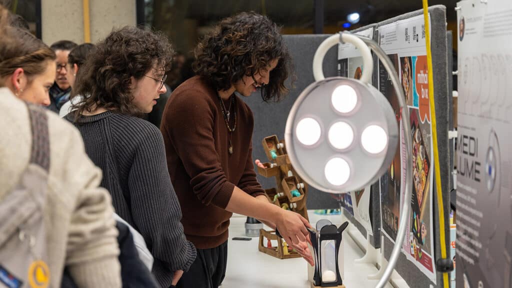 promofall-launchpad-lamps People exploring interactive exhibits at a design gallery, focused on innovations and creativity under bright lighting. | Sky Rye Design People exploring interactive exhibits at a design gallery, focused on innovations and creativity under bright lighting.