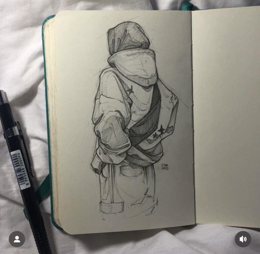 Pencil sketchbook drawing of a hooded streetwear figure wearing a hoodie and backpack, pen resting beside the open notebook.