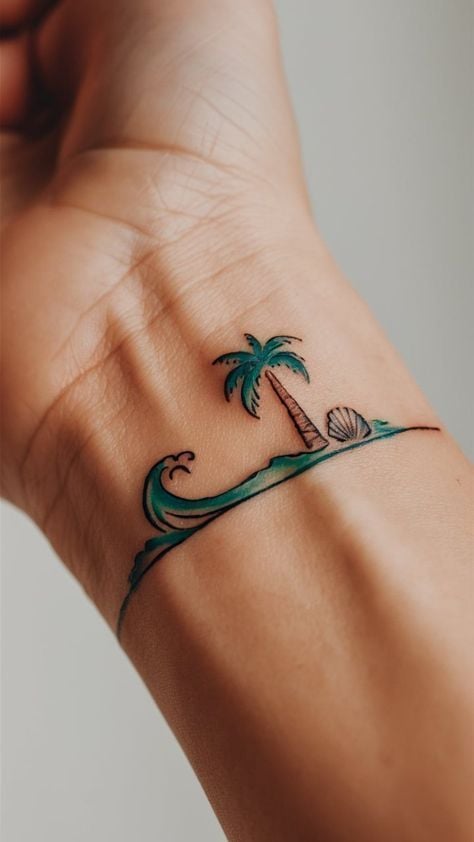Small wrist beach tattoo: minimalist palm tree, rolling wave and seashell in teal and brown ink.