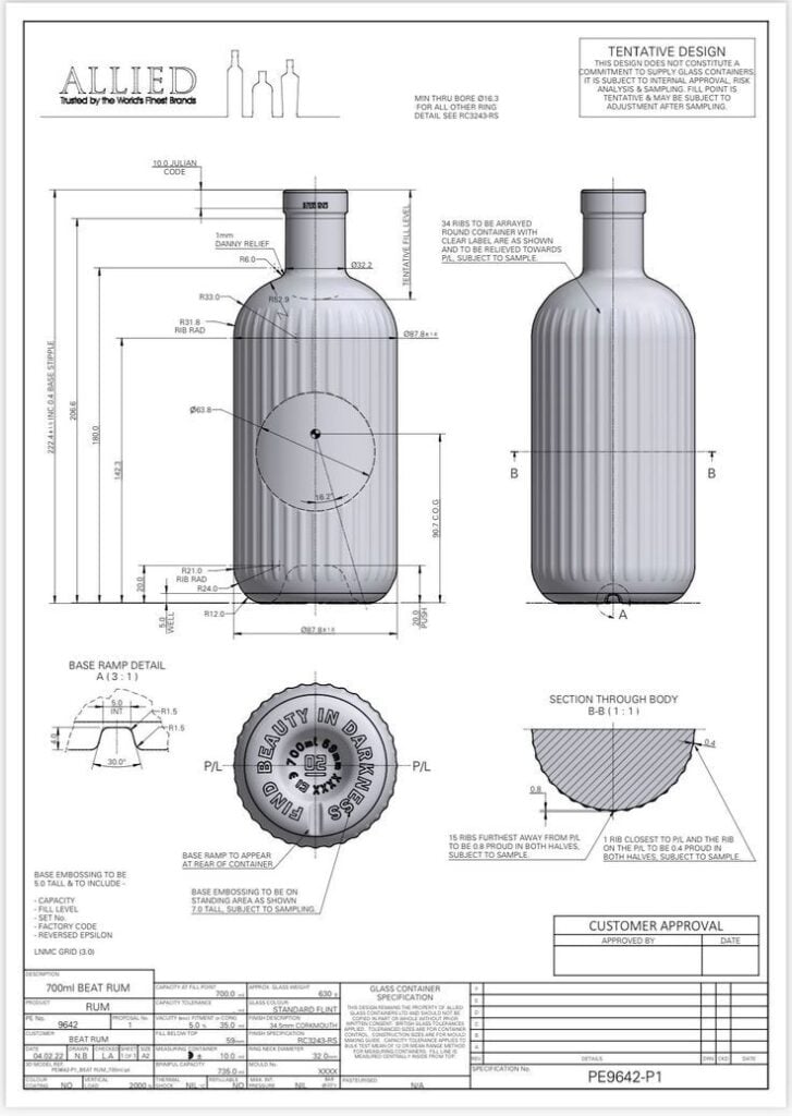 700ml glass rum bottle blueprint: technical CAD drawing with dimensions, ribbed body, cap embossing and base detail