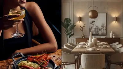 Fine dining scene: plated lobster and cocktail in foreground beside an elegant modern dining room set for a formal dinner