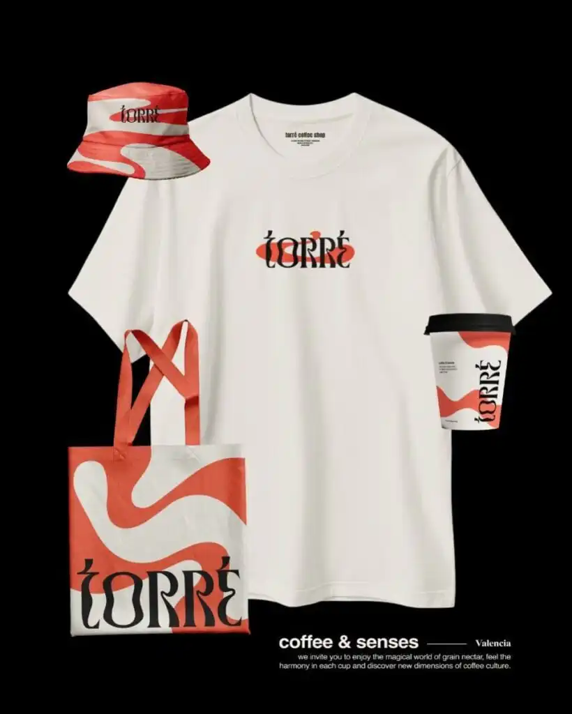 Torré coffee shop merch: white logo tee, red swirled tote, matching bucket hat and branded takeaway coffee cup