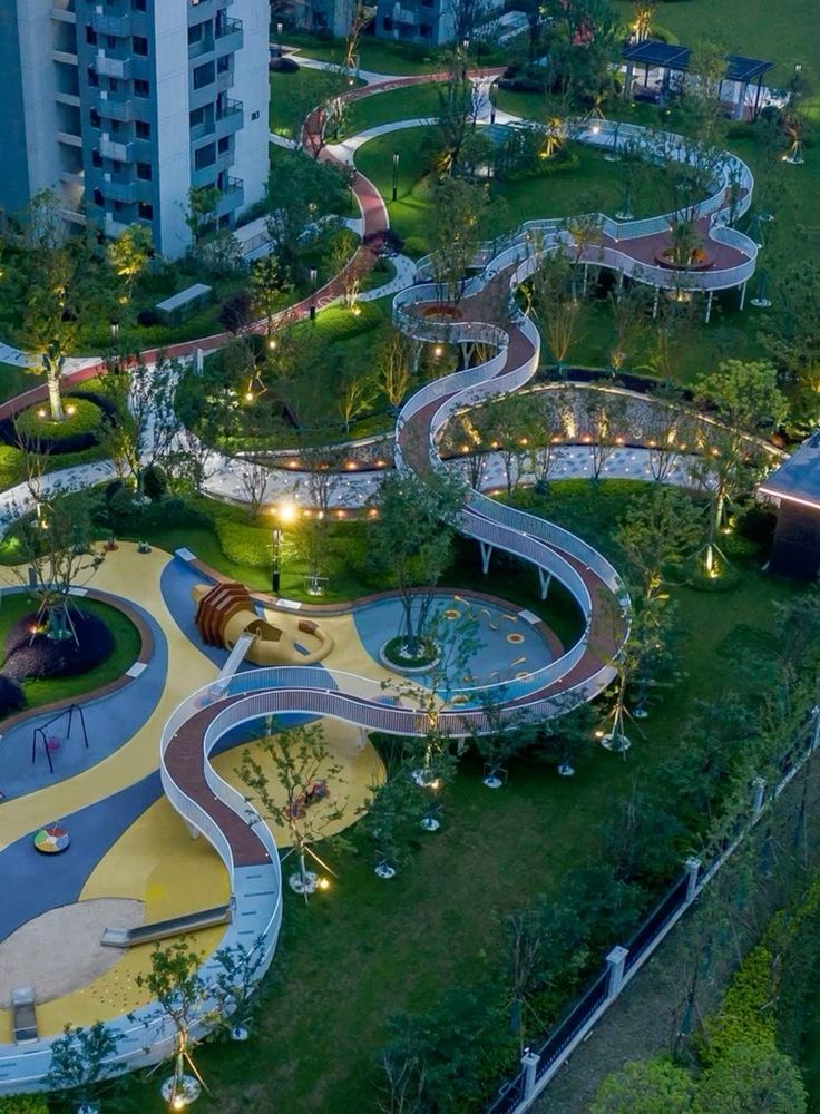 5854fbee4161bc5ca020c921c2b288d6 Aerial night view of modern residential park with illuminated winding elevated walkway and playground | Sky Rye Design Aerial night view of modern residential park with illuminated winding elevated walkway and playground