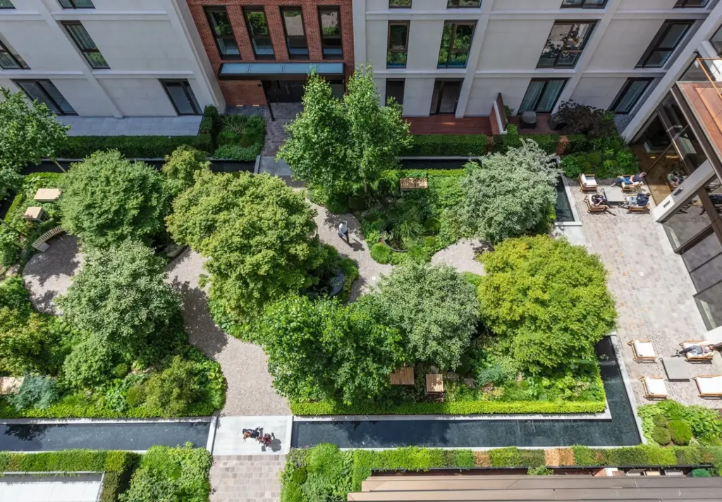 2 Aerial view of landscaped courtyard with paths, mature trees, benches and water features between urban apartments | Sky Rye Design Aerial view of landscaped courtyard with paths, mature trees, benches and water features between urban apartments