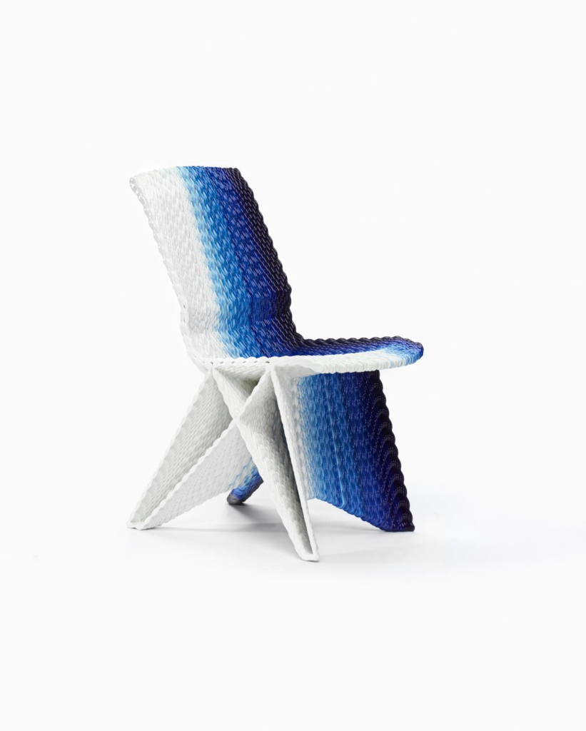 Modern blue-to-white woven designer chair with gradient texture and geometric X-shaped base on white background