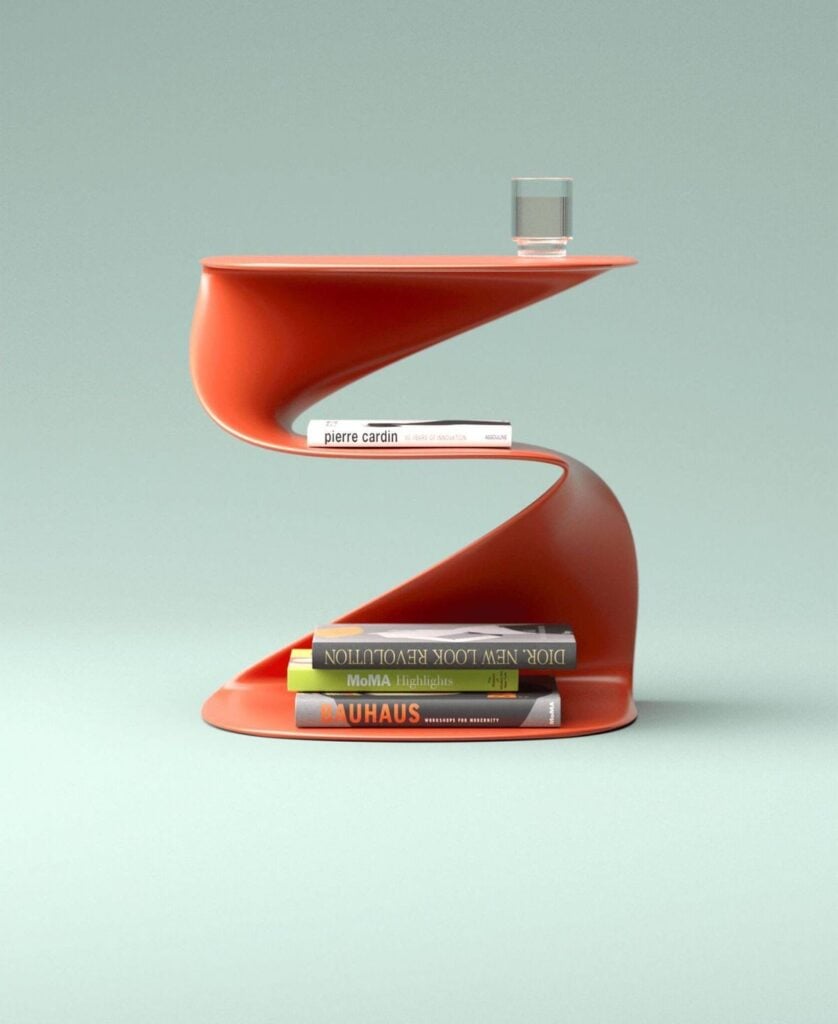 Modern S-shaped orange side table with stacked art books (Bauhaus, MoMA) and a glass of water on pale green background