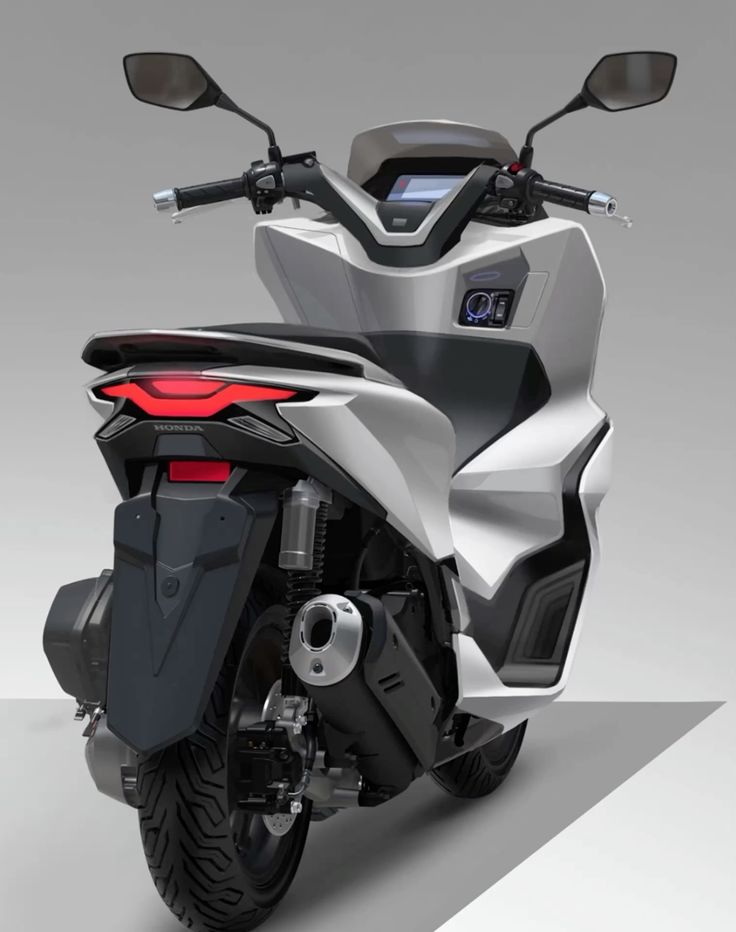 White Honda urban scooter, rear three-quarter view with LED taillight, exhaust, rear wheel and digital display
