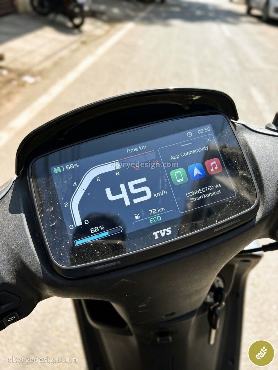 TVS electric scooter digital dashboard displaying 45 km/h, 68% battery, 72 km range and app connectivity icons
