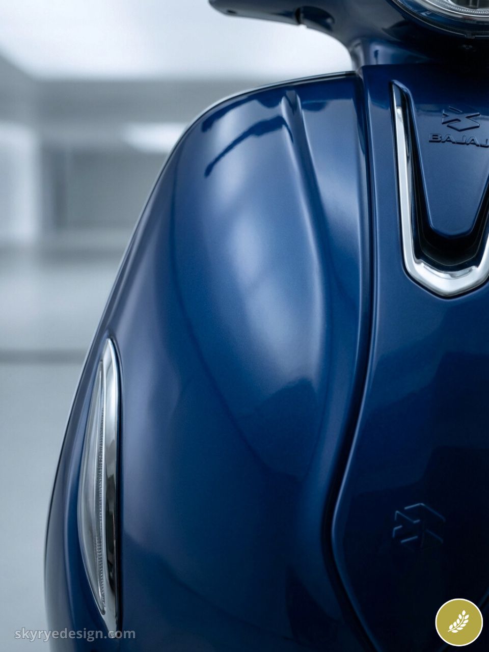 Glossy blue Bajaj scooter front close-up showing sleek panel, chrome headlight trim and modern retro styling