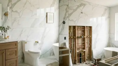Modern marble bathroom remodel with freestanding tub, toilet, wooden vanity and exposed copper plumbing during renovation