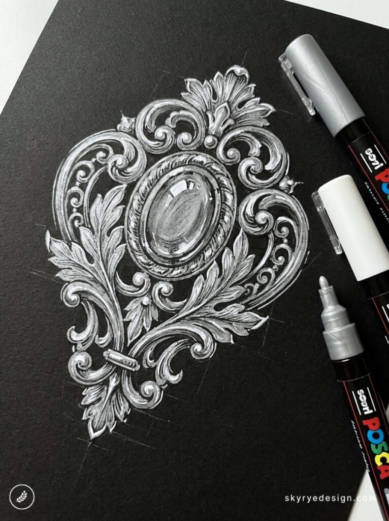 Ornate baroque scrollwork sketch on black paper in white POSCA marker, decorative medallion and flourishes