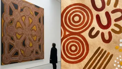 Museum visitor viewing large Aboriginal dot painting with ochre and red concentric circles; close-up of Indigenous motifs