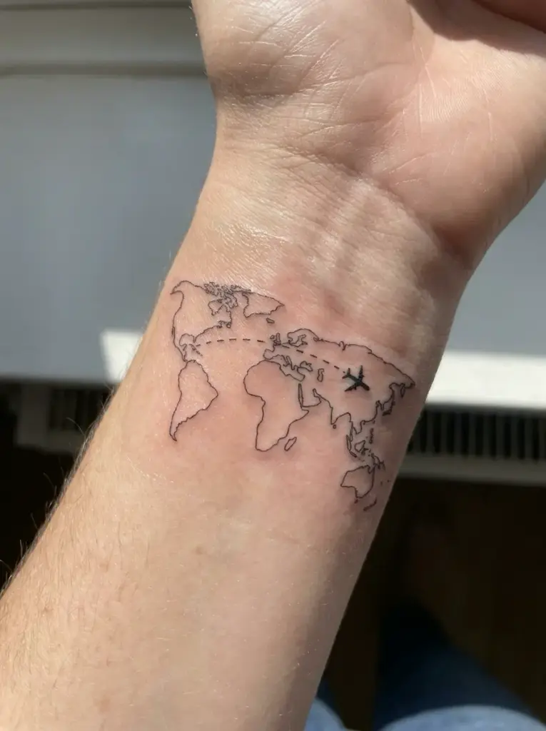 travel tattoo forearm