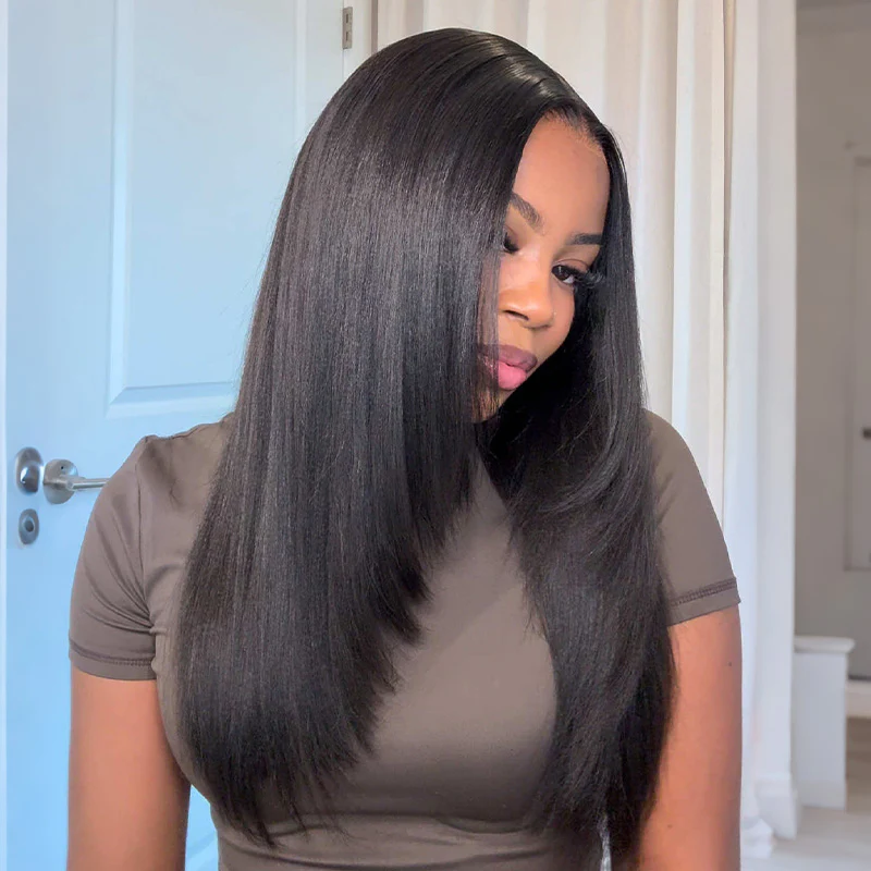 Sleek long straight hair with deep side part on woman in brown tee — salon-style hair portrait