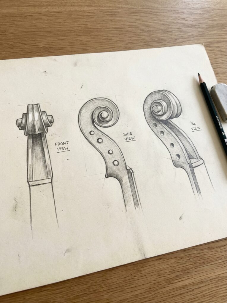 d0f9f53c-45ca-473f-8280-c8e539deae1b Hand-drawn pencil sketches of a violin scroll: front, side and 3/4 views on paper with pencil and eraser. | Sky Rye Design Hand-drawn pencil sketches of a violin scroll: front, side and 3/4 views on paper with pencil and eraser.
