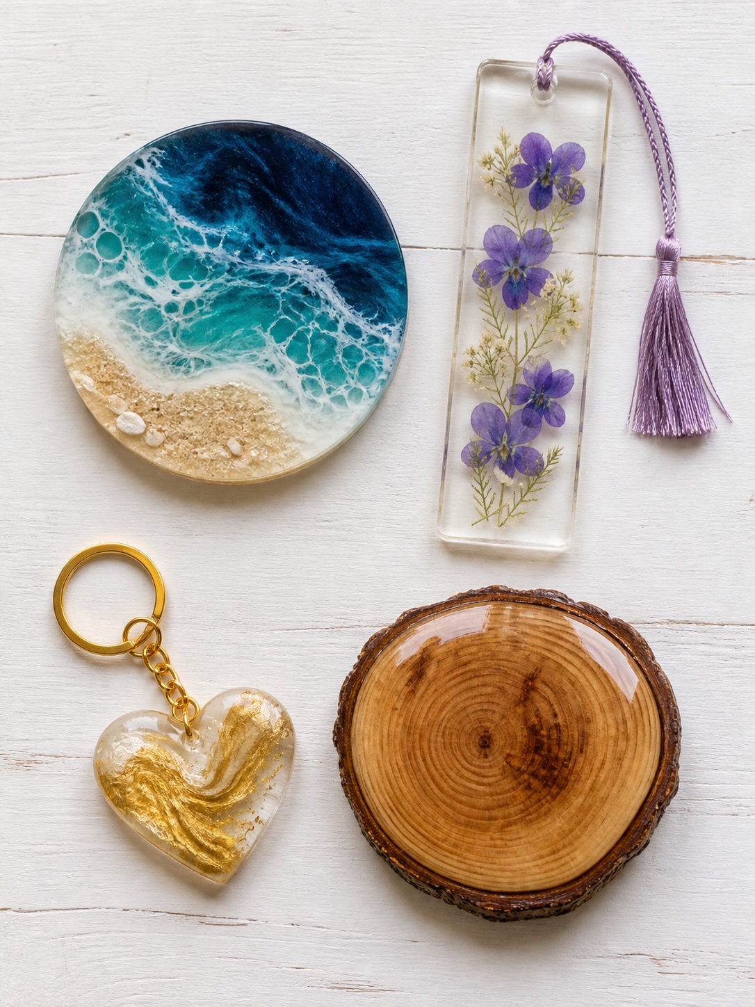 Beginner resin art projects including a coaster, bookmark, keychain and glossy wood slice.