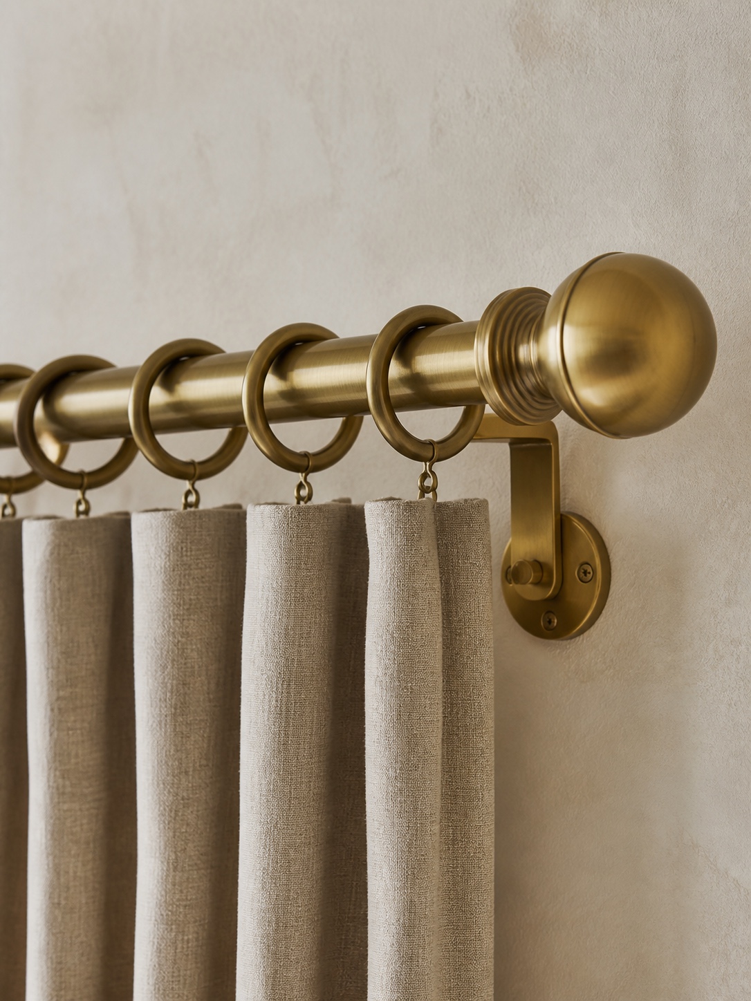 Brass curtain rod for custom drapes Solid brass curtain rod with rings, finial, and wall bracket for supporting heavy custom drapes. | Sky Rye Design Solid brass curtain rod with rings, finial, and wall bracket for supporting heavy custom drapes.