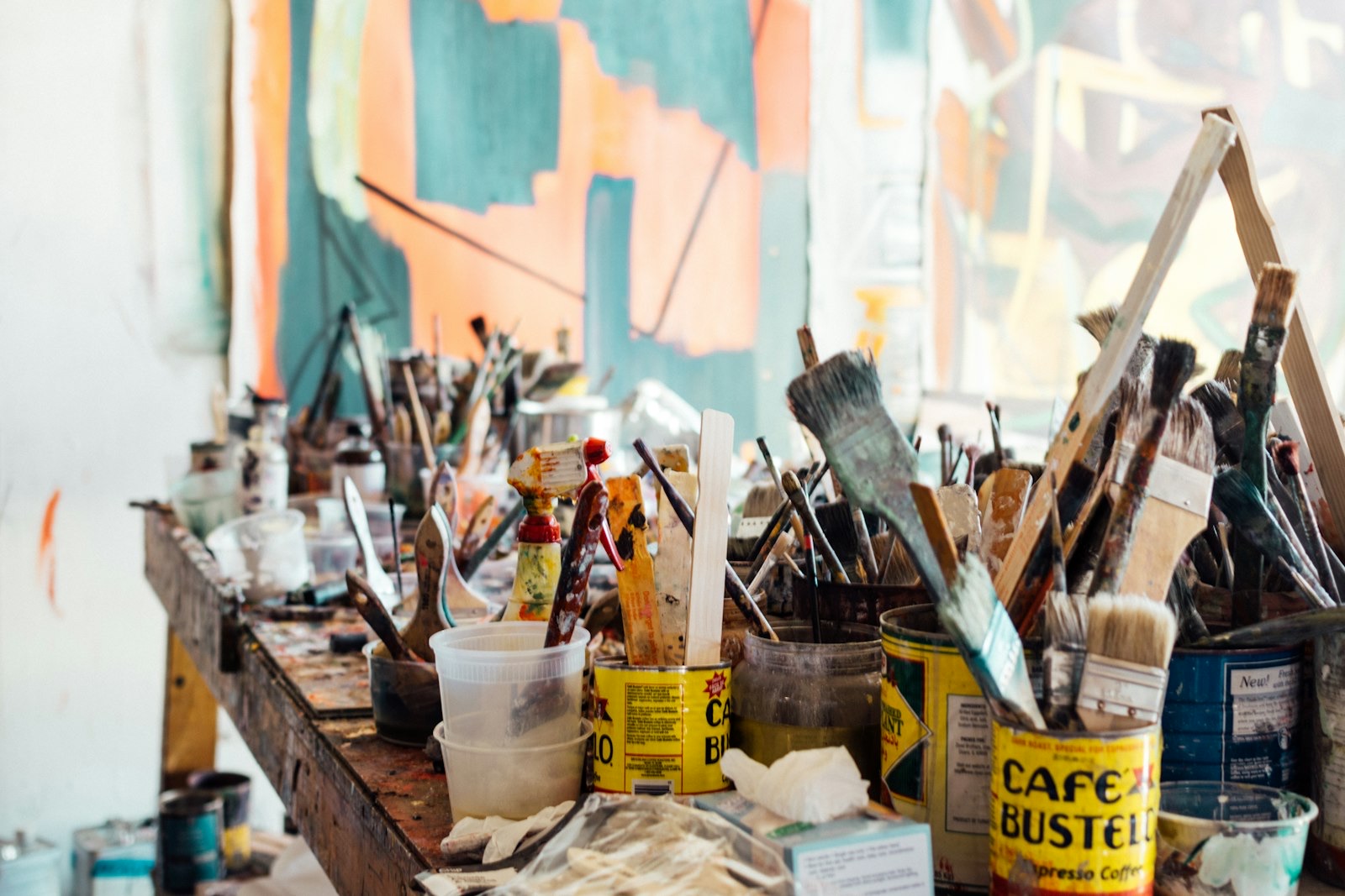 Artists collaborating in a lively studio environment
