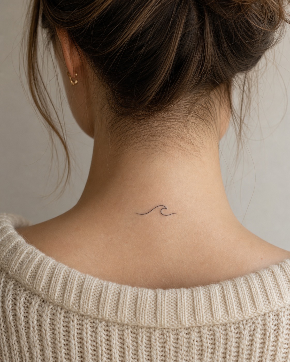 Gentle wave nape tattoo Gentle fine-line wave tattoo on the nape below the hairline in soft natural light. | Sky Rye Design Gentle fine-line wave tattoo on the nape below the hairline in soft natural light.