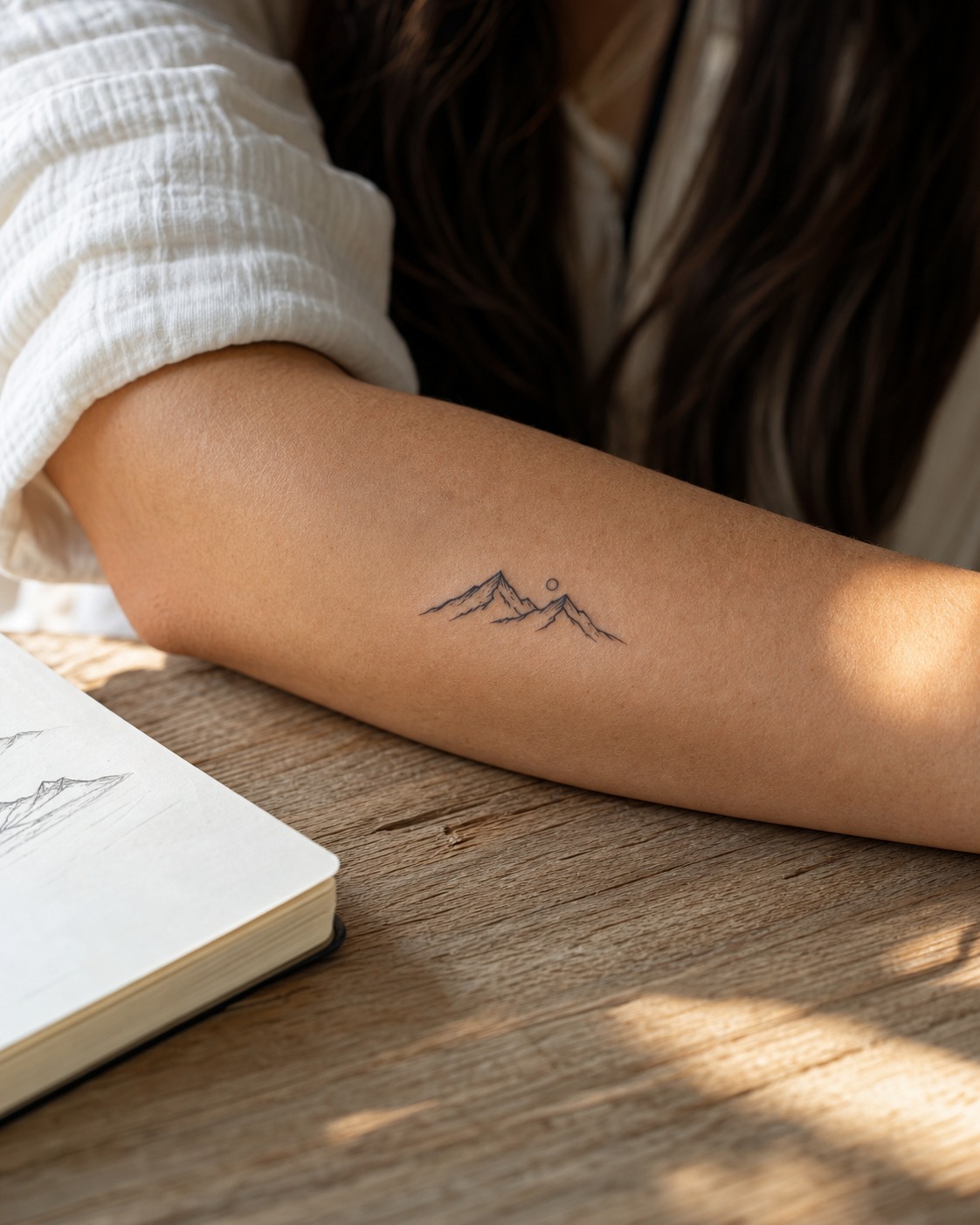 Minimalist mountain forearm tattoo Minimalist mountain range tattoo on the forearm in delicate fine black linework. | Sky Rye Design Minimalist mountain range tattoo on the forearm in delicate fine black linework.