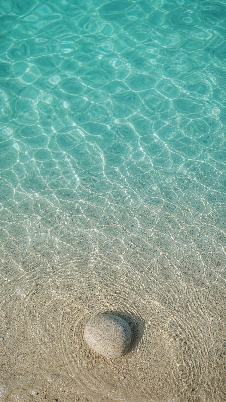Ocean aesthetic wallpaper digital HD with turquoise water ripples and pale sand.