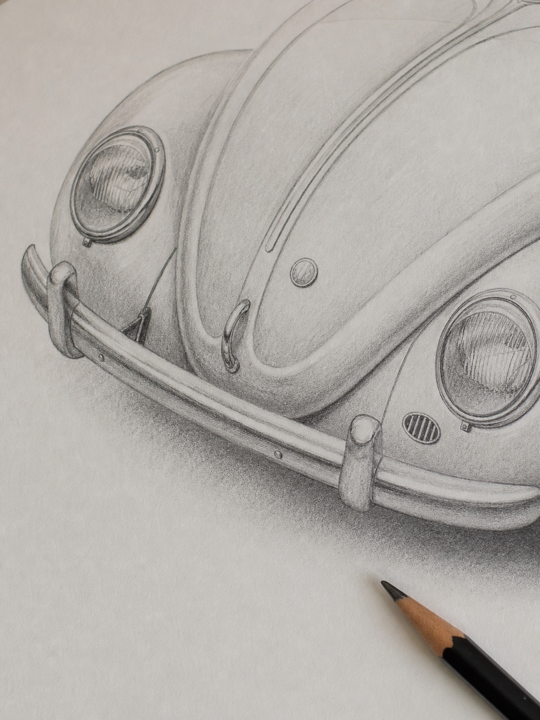 VW Beetle headlight pencil detail Close-up pencil drawing of a Volkswagen Beetle front end with oval headlights, bumper, hood badge, and soft shading. | Sky Rye Design Close-up pencil drawing of a Volkswagen Beetle front end with oval headlights, bumper, hood badge, and soft shading.