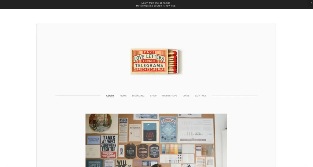Vintage matchbox labeled'Fake Love Letters, Forged Telegrams & Prison Escape Maps' centered on white website header