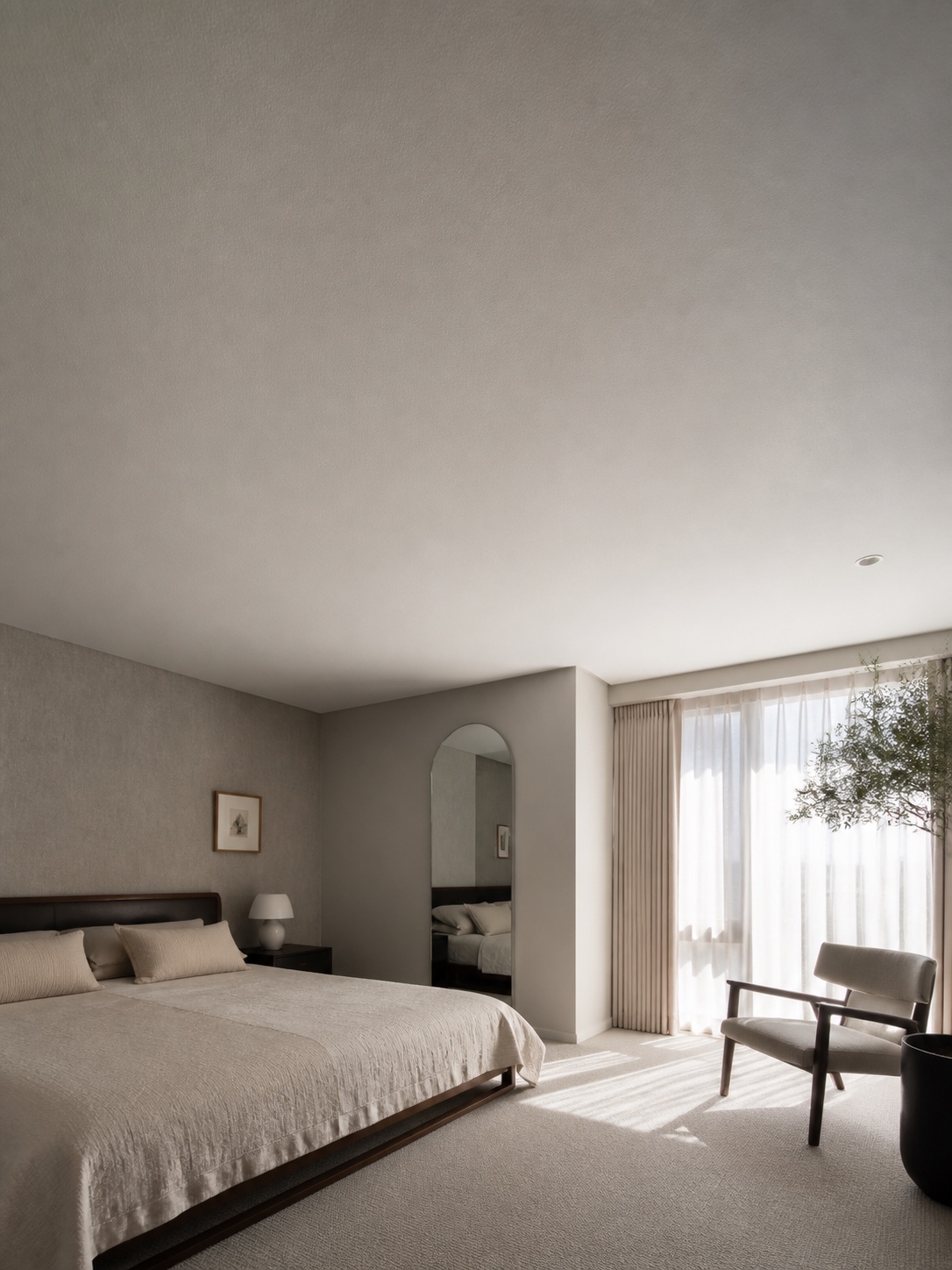 Wide primary bedroom with a seamless matte fabric stretch ceiling.