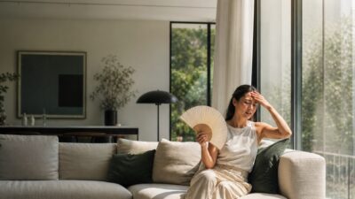 A sunny living room hot spot making a seated person visibly uncomfortable.