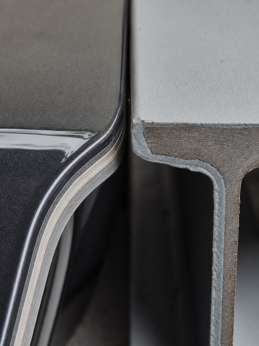 Car Body Vs Structural Beam Finish Comparison Close-up comparison of layered automotive paint and industrial primer on structural steel. | Sky Rye Design Close-up comparison of layered automotive paint and industrial primer on structural steel.