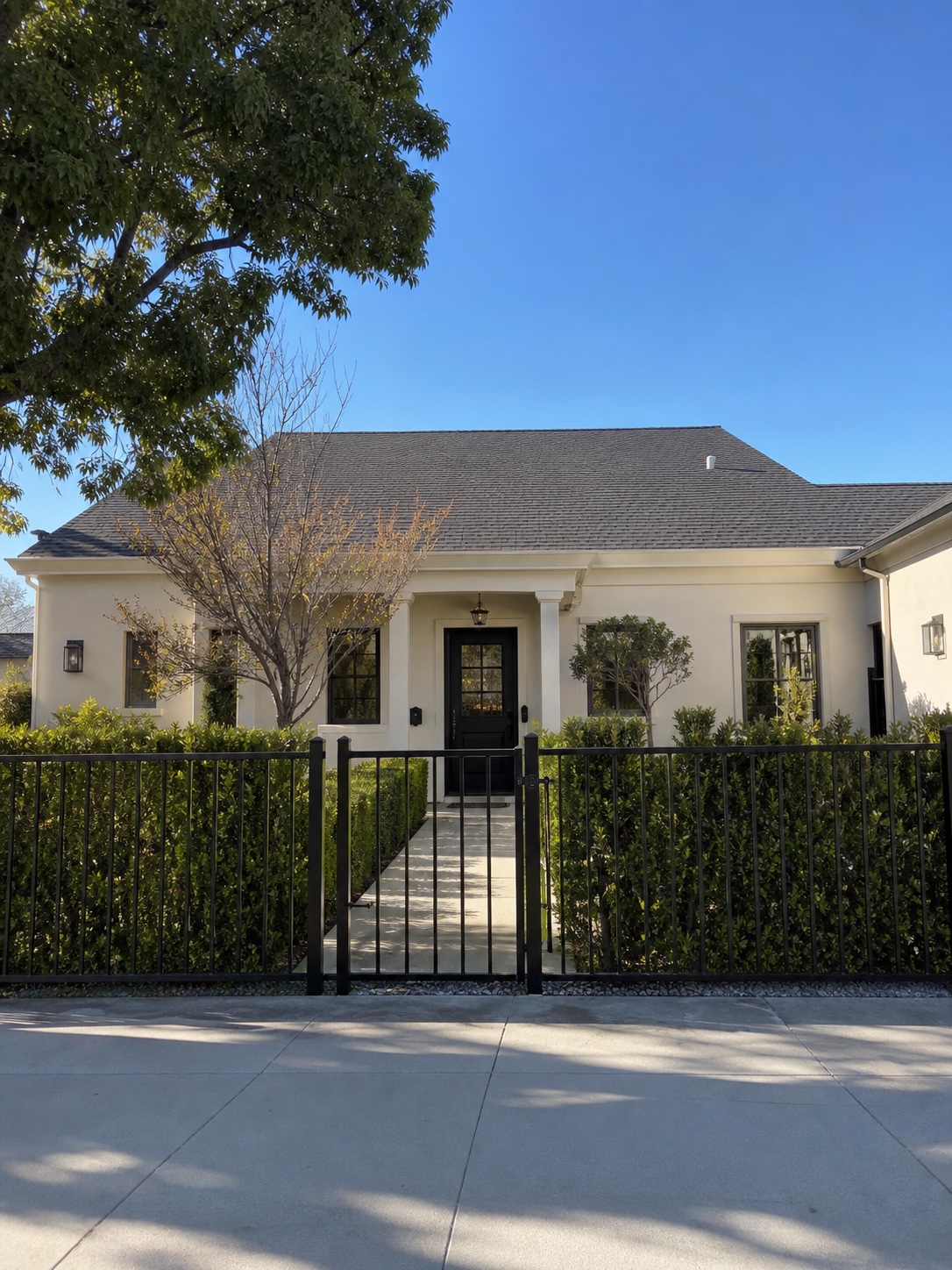 Completed black aluminum fence around a maintained Van Nuys front yard