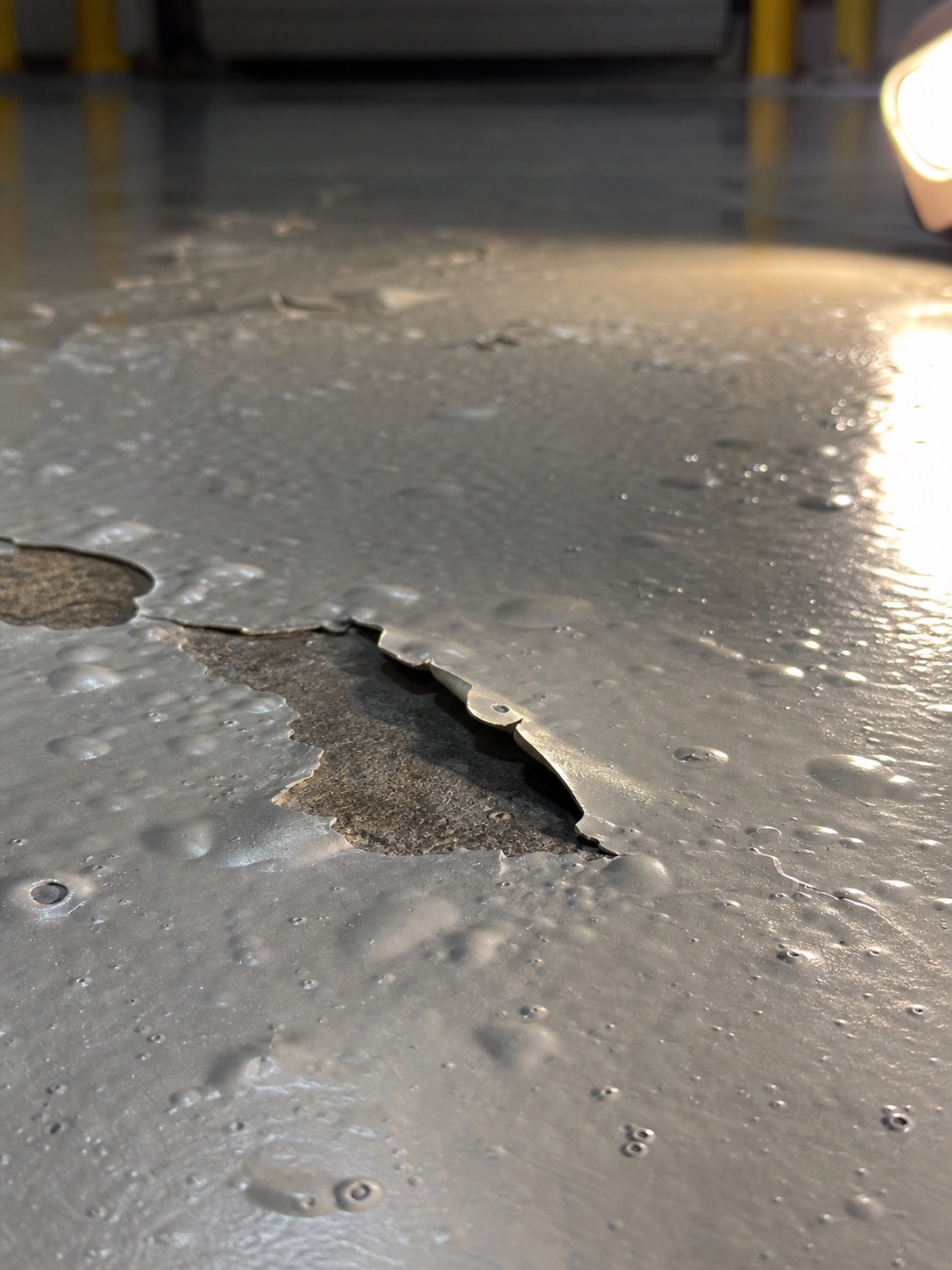 Epoxy Floor Blistering From Moisture Vapor Industrial epoxy floor with blistering and delamination from moisture vapor transmission. | Sky Rye Design Industrial epoxy floor with blistering and delamination from moisture vapor transmission.