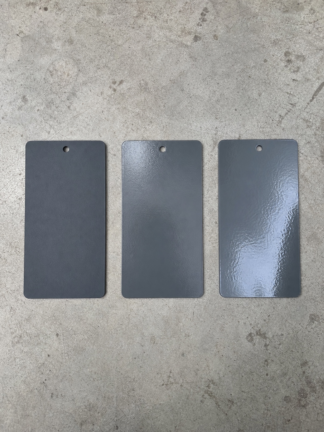 Polymer Coating Types Macro Three industrial coating sample cards showing epoxy, polyurethane, and fluoropolymer finishes. | Sky Rye Design Three industrial coating sample cards showing epoxy, polyurethane, and fluoropolymer finishes.