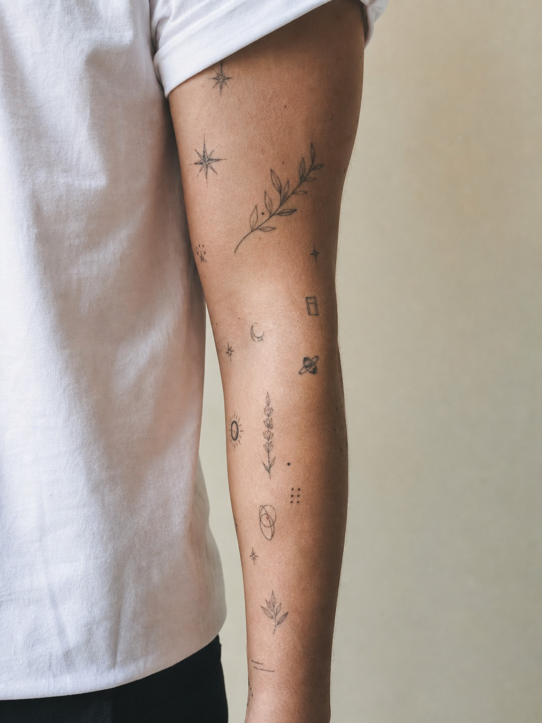 Minimalist patchwork sleeve tattoo for men Minimalist patchwork sleeve tattoo for men with small black symbols and negative space | Sky Rye Design Minimalist patchwork sleeve tattoo for men with small black symbols and negative space