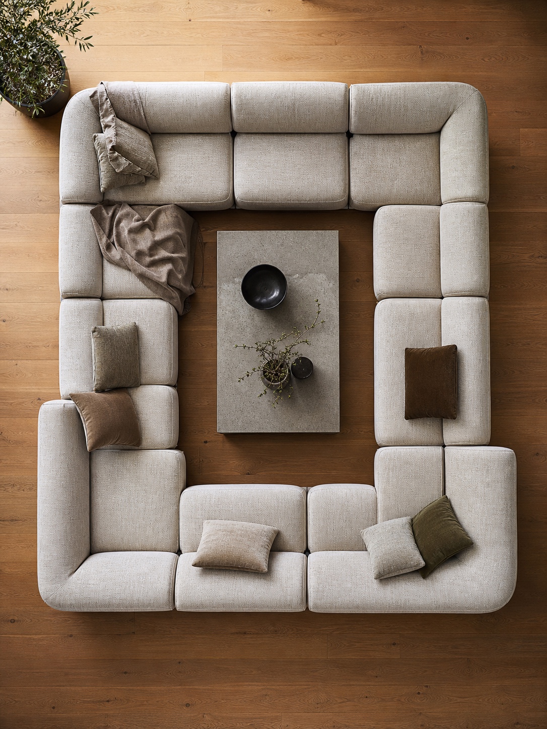 Top-down view of a modular sectional sofa arranged in a U shape around a coffee table.