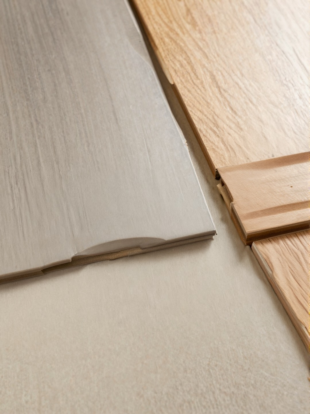 Safe flooring materials for 55+ homes including low-pile carpet, matte vinyl plank, wood, and flush threshold.