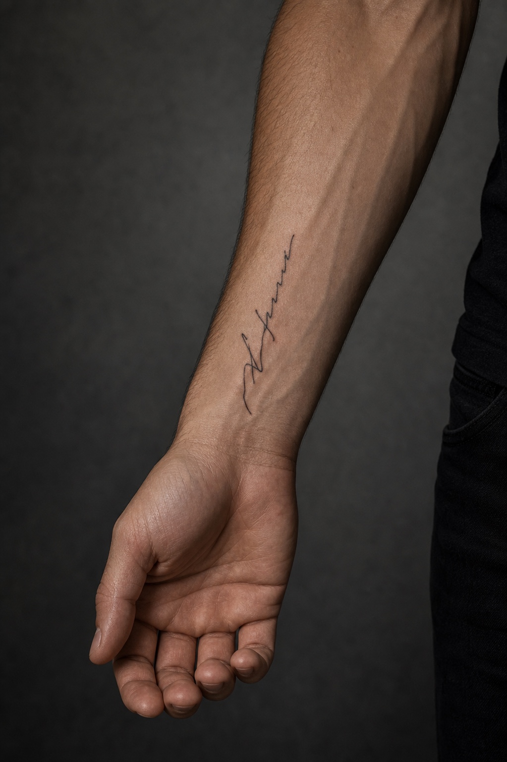 Minimal male script with personal meaning tattoo placement idea