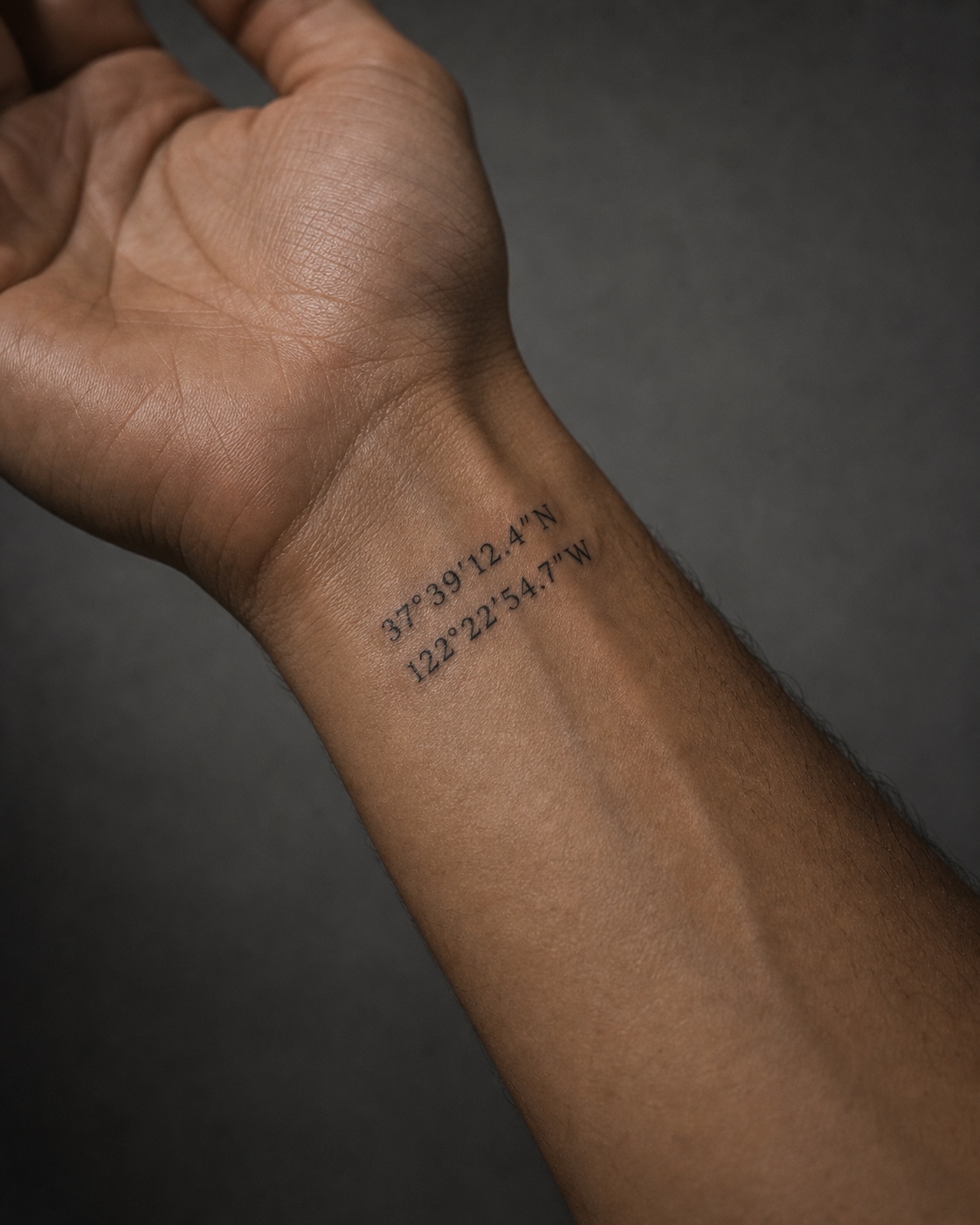 Minimal male birth coordinates tattoo placement idea