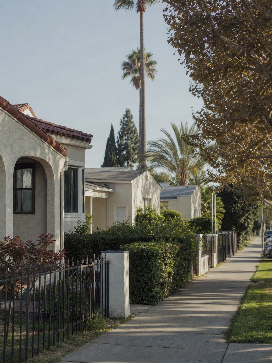Van Nuys residential street with stucco homes and front yard fence examples