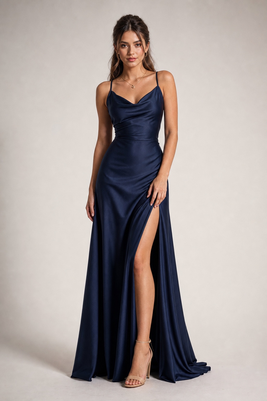 Deep navy satin A-line prom dress Adult model wearing a deep navy satin A-line prom dress in a studio catalog photo | Sky Rye Design Adult model wearing a deep navy satin A-line prom dress in a studio catalog photo