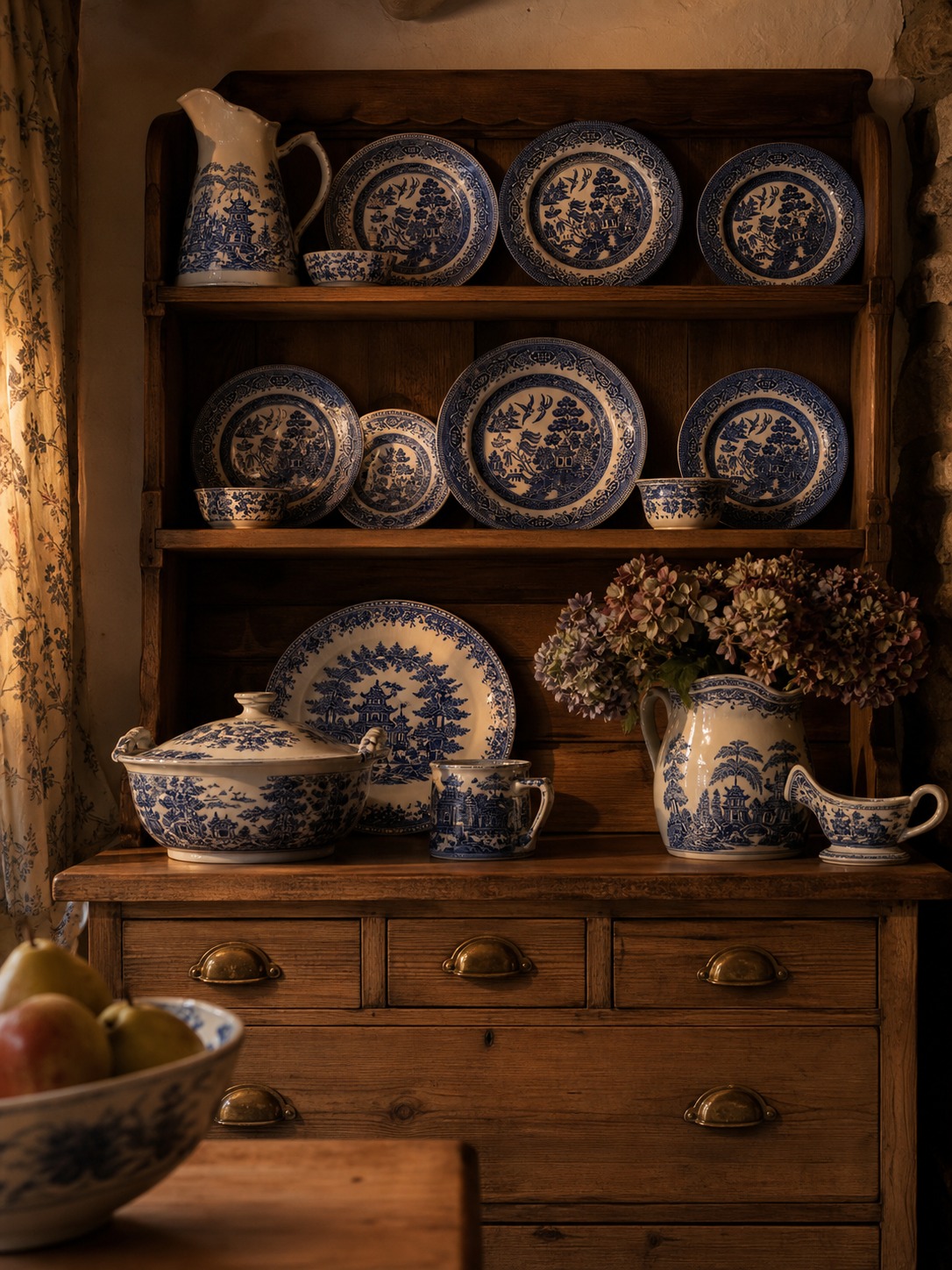 Antique pine dresser displaying blue and white willow pattern china plates and jugs in an English cottage kitchen Antique pine dresser displaying blue and white willow pattern china plates and jugs in an English cottage kitchen. | Sky Rye Design Antique pine dresser displaying blue and white willow pattern china plates and jugs in an English cottage kitchen.
