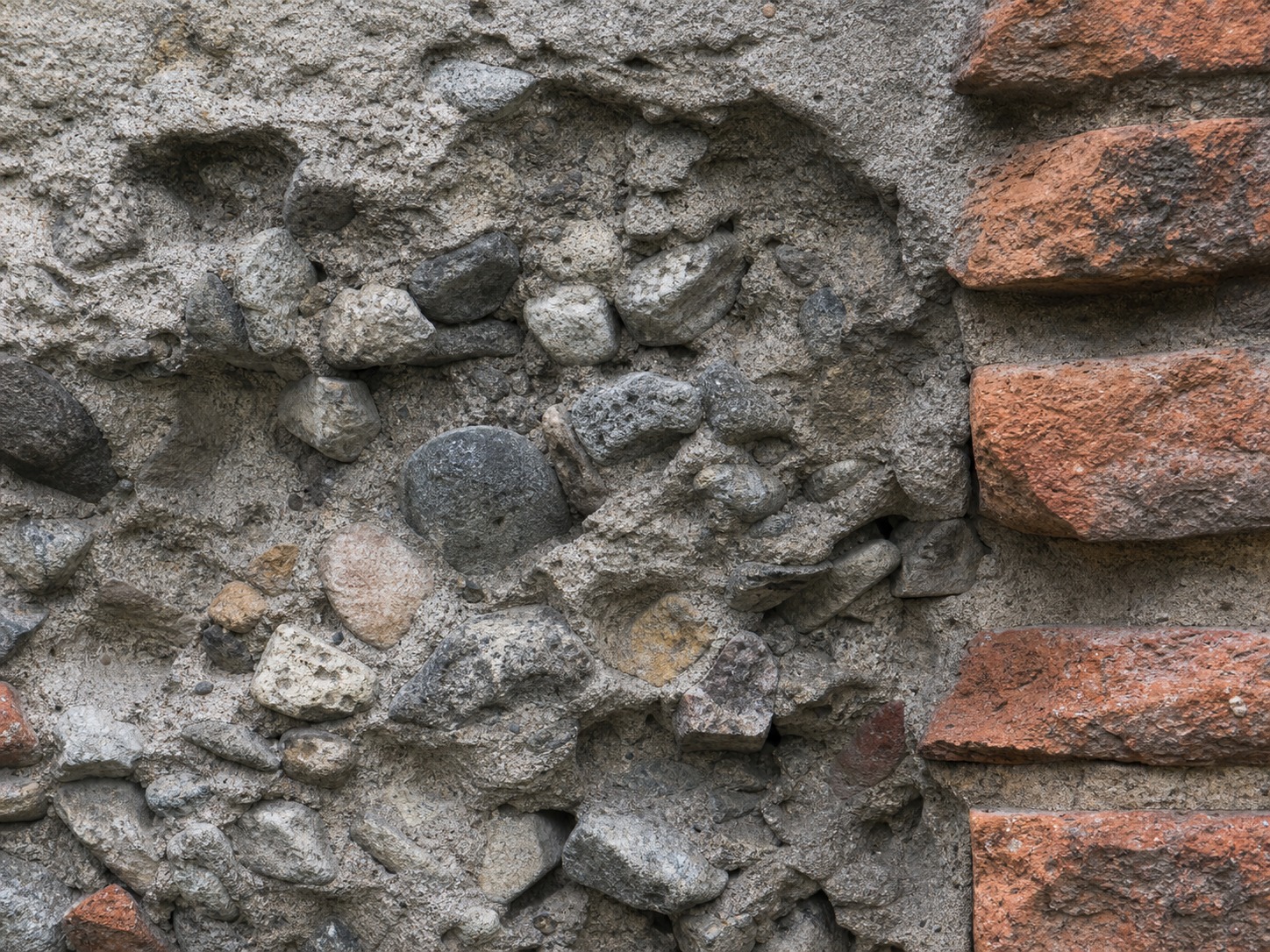 Ancient Roman concrete wall cross-section Broken Roman concrete wall cross-section showing rubble aggregate embedded in grey mortar | Sky Rye Design Broken Roman concrete wall cross-section showing rubble aggregate embedded in grey mortar