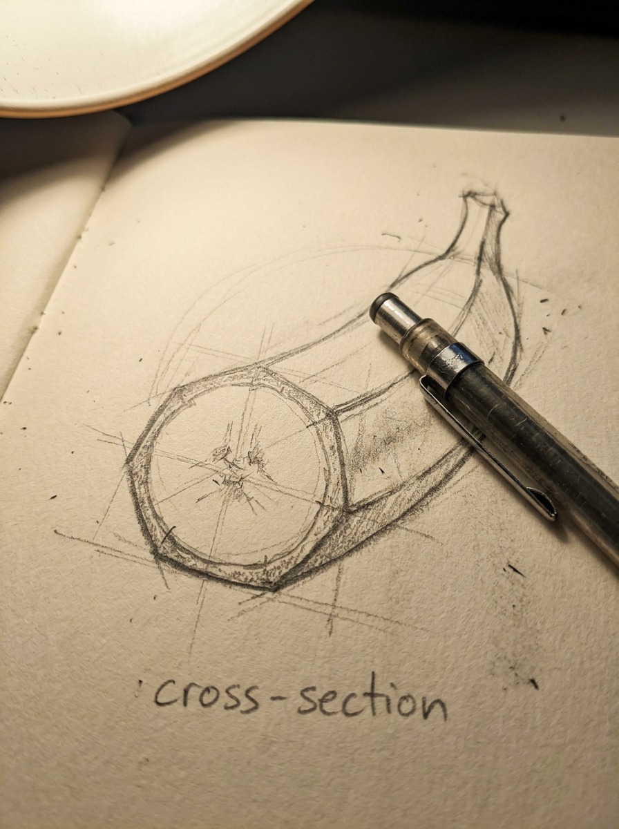 Banana faceted cross-section diagram A close-up sketchbook diagram showing the subtle faceted cross-section of a banana. | Sky Rye Design A close-up sketchbook diagram showing the subtle faceted cross-section of a banana.