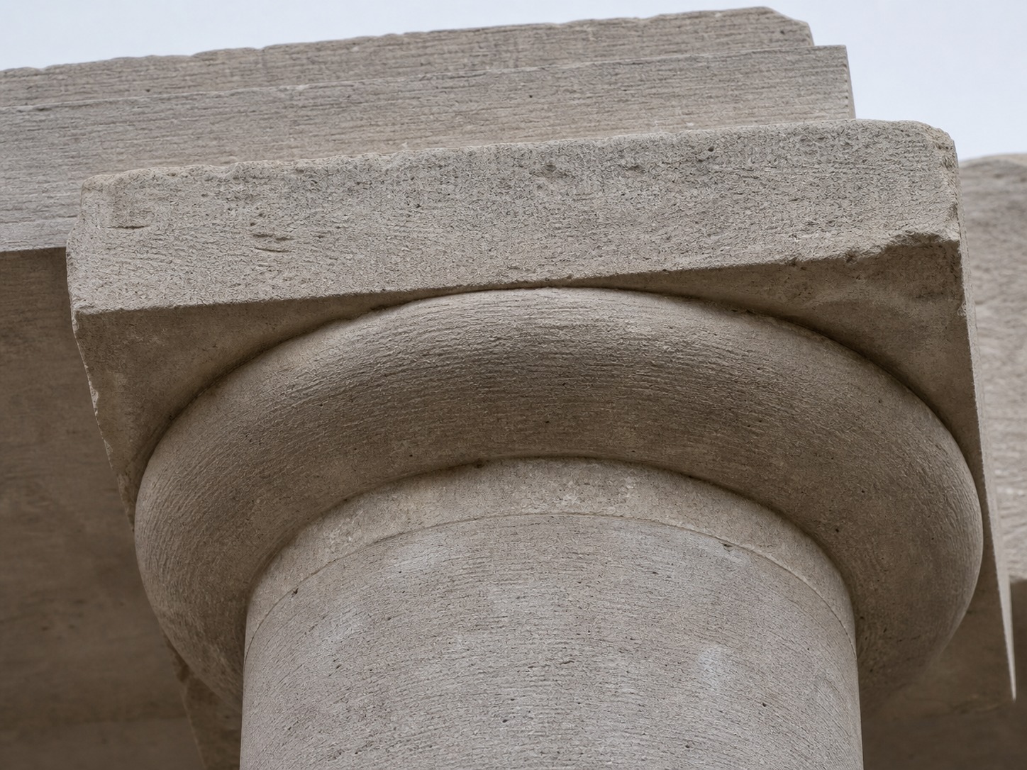 Doric capital close-up Close-up of a plain Doric column capital with a weathered cushion-shaped echinus | Sky Rye Design Close-up of a plain Doric column capital with a weathered cushion-shaped echinus