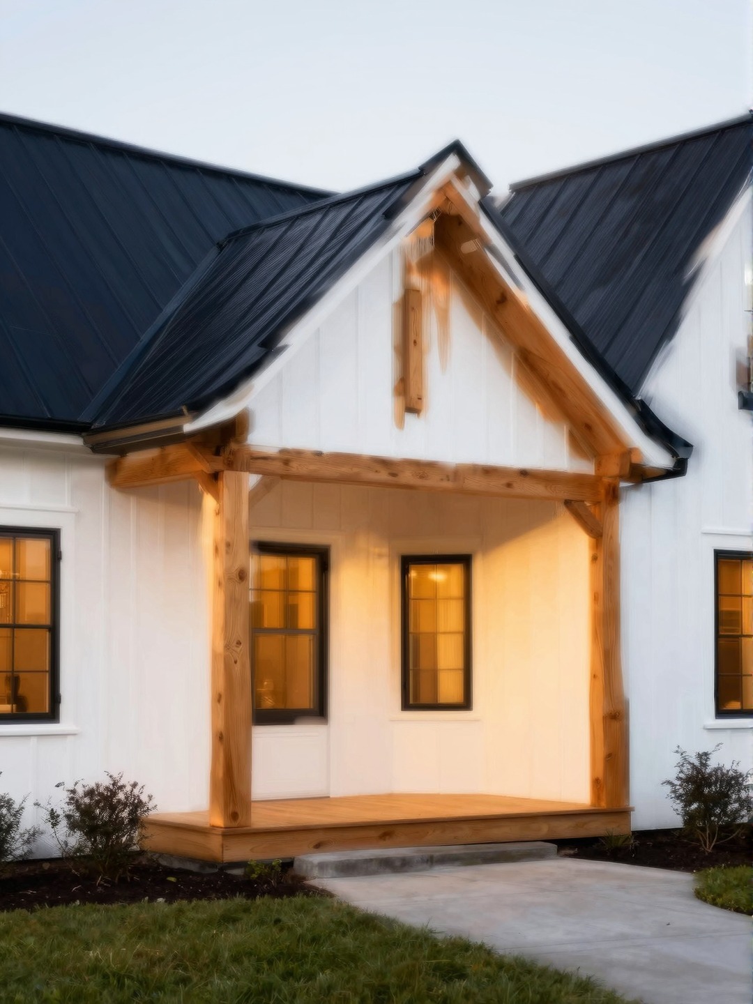 Modern farmhouse dream house exterior with white siding, timber porch beams, and black metal roof.