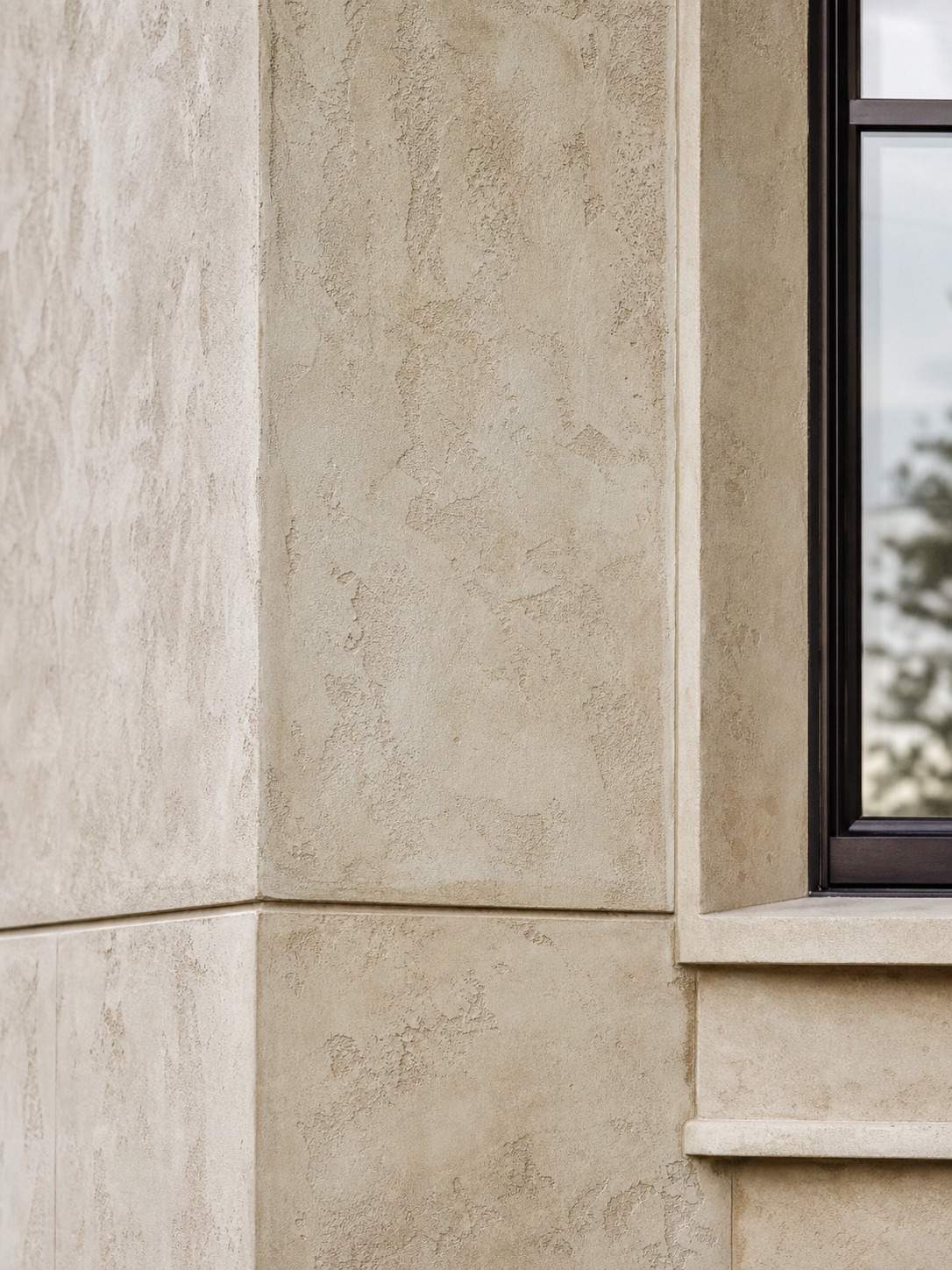 EIFS limestone finish window reveal EIFS facade finish with limestone-like texture at a residential window reveal. | Sky Rye Design EIFS facade finish with limestone-like texture at a residential window reveal.