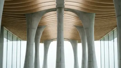 Modern minimalist lounge with sunken beige seating, sculptural concrete columns, wood slatted ceiling and glass walls