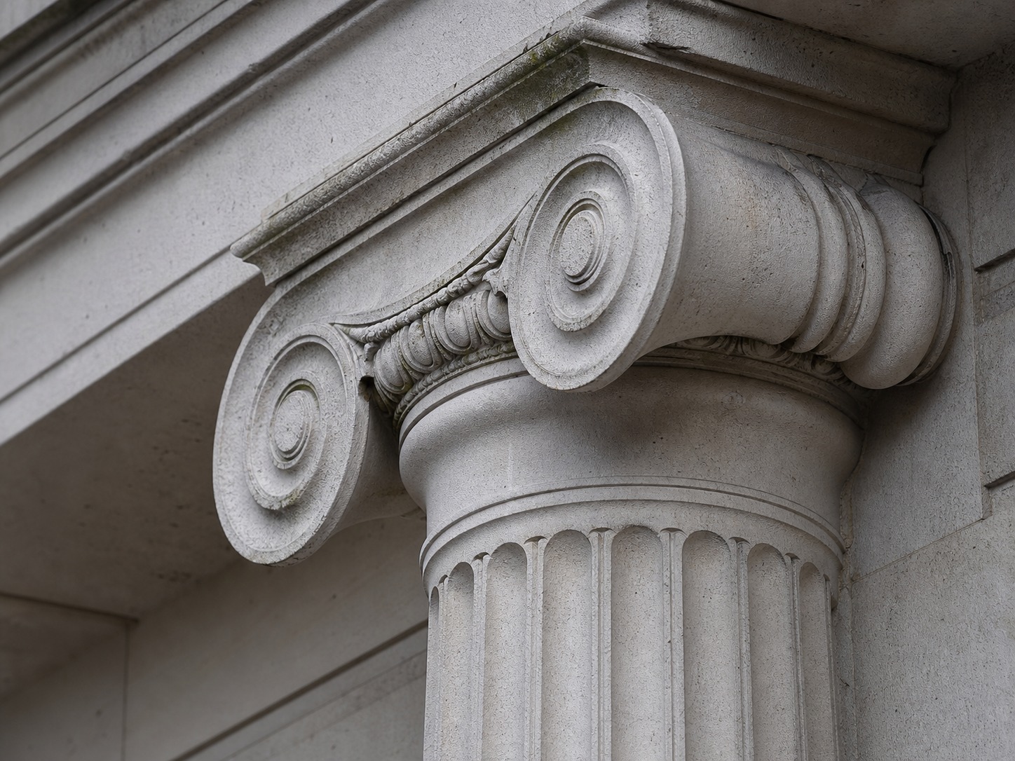 Ionic capital volutes close-up Close-up of an Ionic column capital with scroll-shaped volutes and a slender fluted shaft | Sky Rye Design Close-up of an Ionic column capital with scroll-shaped volutes and a slender fluted shaft
