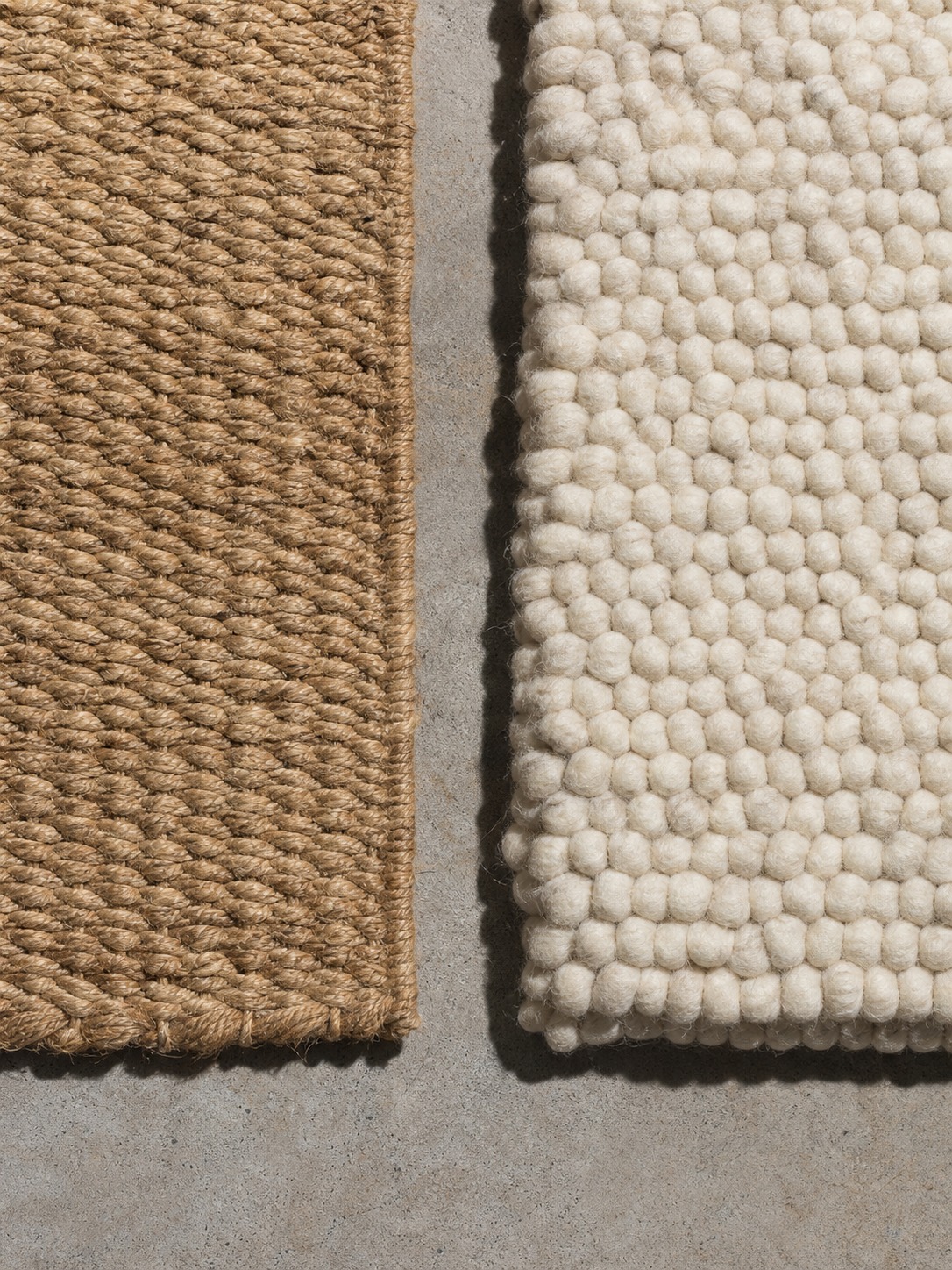 Jute and wool rug material comparison Jute rug and thick wool rug samples compared side by side on a concrete floor. | Sky Rye Design Jute rug and thick wool rug samples compared side by side on a concrete floor.